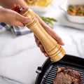 Wooden pepper mill.