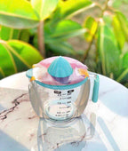Juicer and measuring flask with acrylic handle
